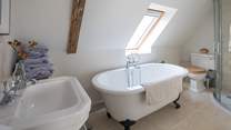 The en suite bathroom for the master bedroom with corner shower cubicle.