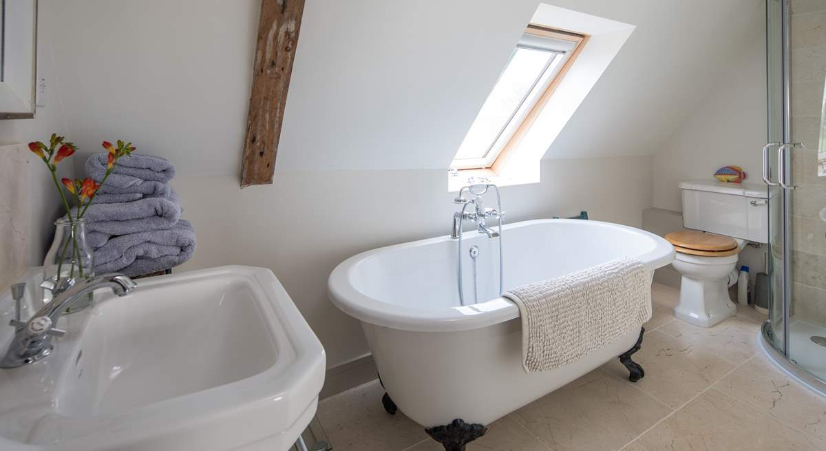 The en suite bathroom for the master bedroom with corner shower cubicle.