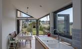 The dining-area has bi-fold and tri-fold doors, that open to bring the outside in. - Thumbnail Image