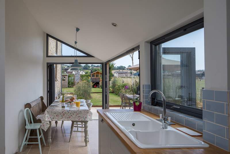 The dining-area has bi-fold and tri-fold doors, that open to bring the outside in.