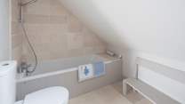 Th en suite bathroom for bedroom 3, great for soaking sandy children.