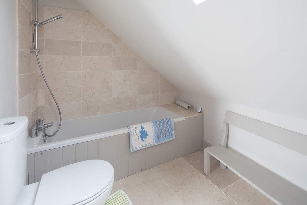 Th en suite bathroom for bedroom 3, great for soaking sandy children.