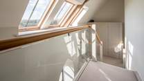 The first floor landing is flooded with light and reveals the structure of this beautiful renovation.