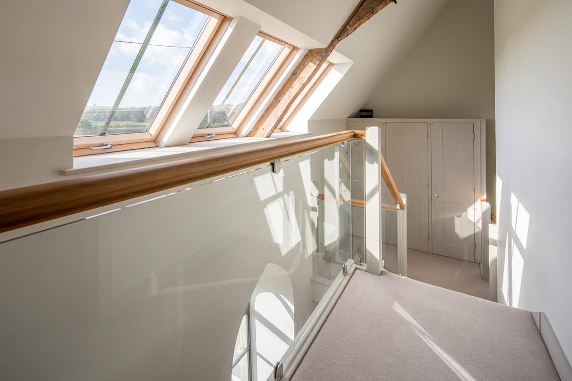 The first floor landing is flooded with light and reveals the structure of this beautiful renovation.