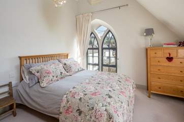 The super-comfy 5ft king-size bed in this bedroom flooded with light.