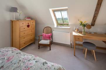 The master bedroom looks out over the surrounding fields.