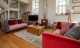 This wonderful open plan sitting-room has a cosy wood-burner for cooler evenings. - Thumbnail Image