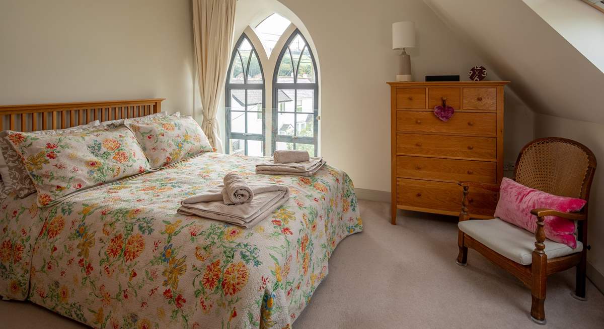 The super-comfy 5ft king-size bed in this bedroom flooded with light.