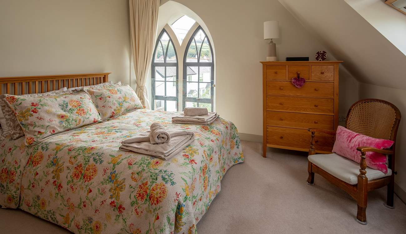 The super-comfy 5ft king-size bed in this bedroom flooded with light.