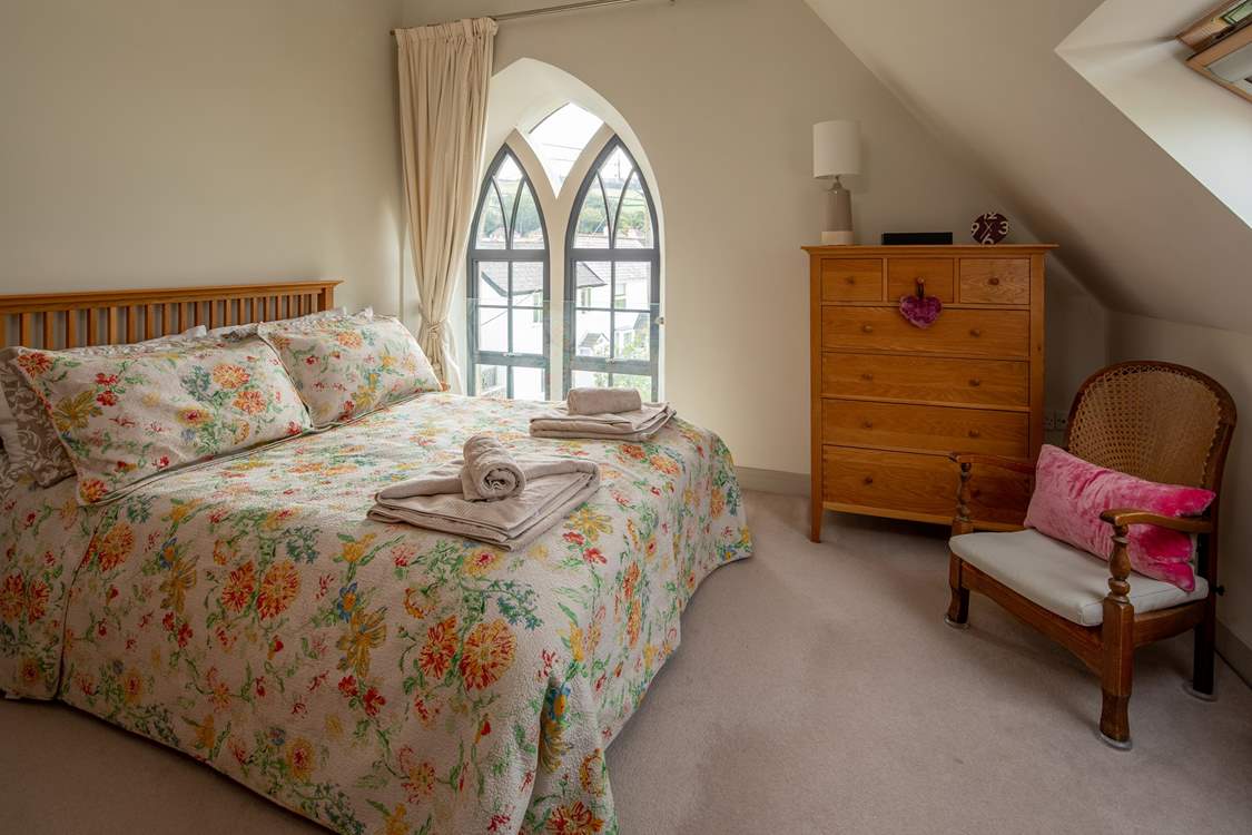 The super-comfy 5ft king-size bed in this bedroom flooded with light.