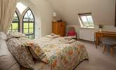 The master bedroom has this beautiful feature window, protected by a glass safety screen. - Thumbnail Image