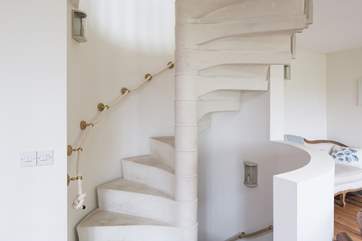 Stunning spiral staircase which takes you up to the master bedroom, down to the garden-room and out to the stunning walled rose garden.