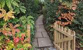 Once parked up, follow this pretty pathway to access your dream holiday cottage. - Thumbnail Image