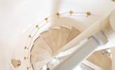 Looking down the stunning spiral staircase from bedroom two. - Thumbnail Image