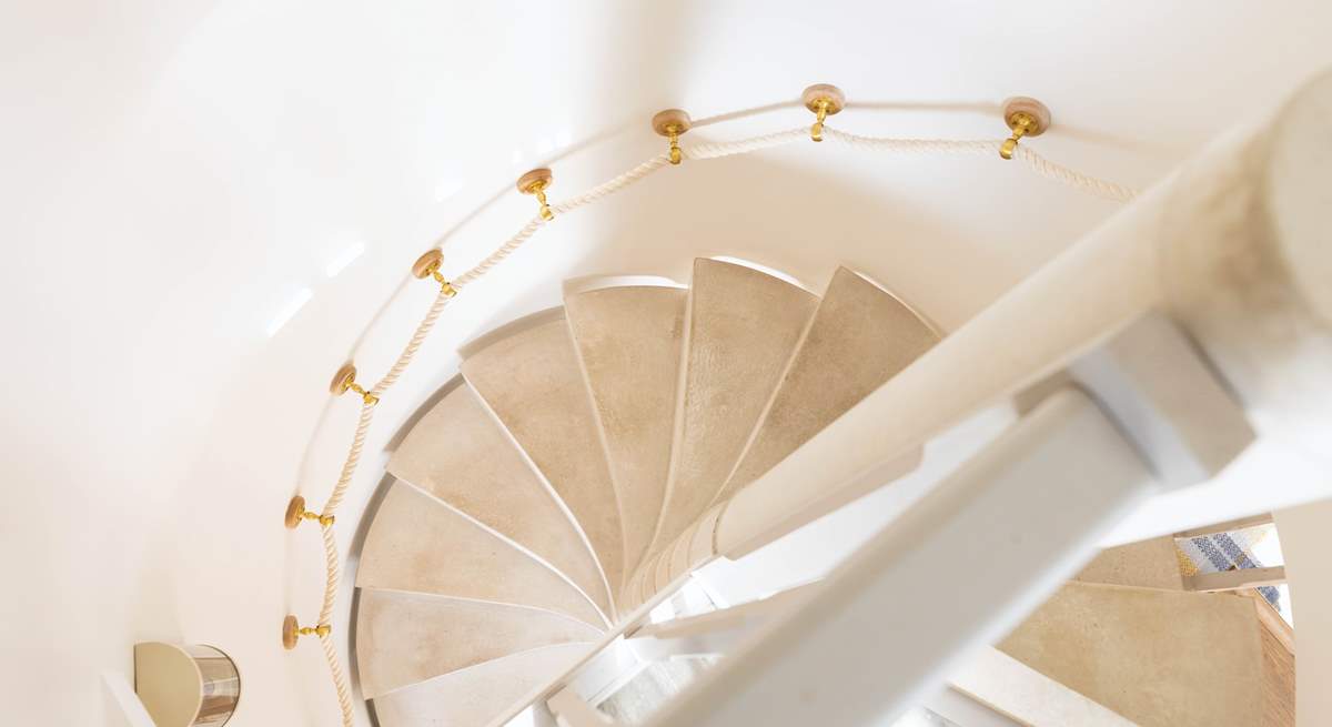 Looking down the stunning spiral staircase from bedroom two.