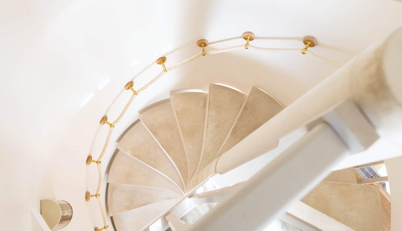 Looking down the stunning spiral staircase from bedroom two.