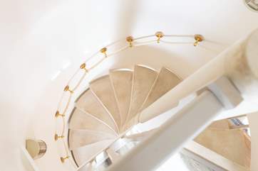 Looking down the stunning spiral staircase from bedroom two.