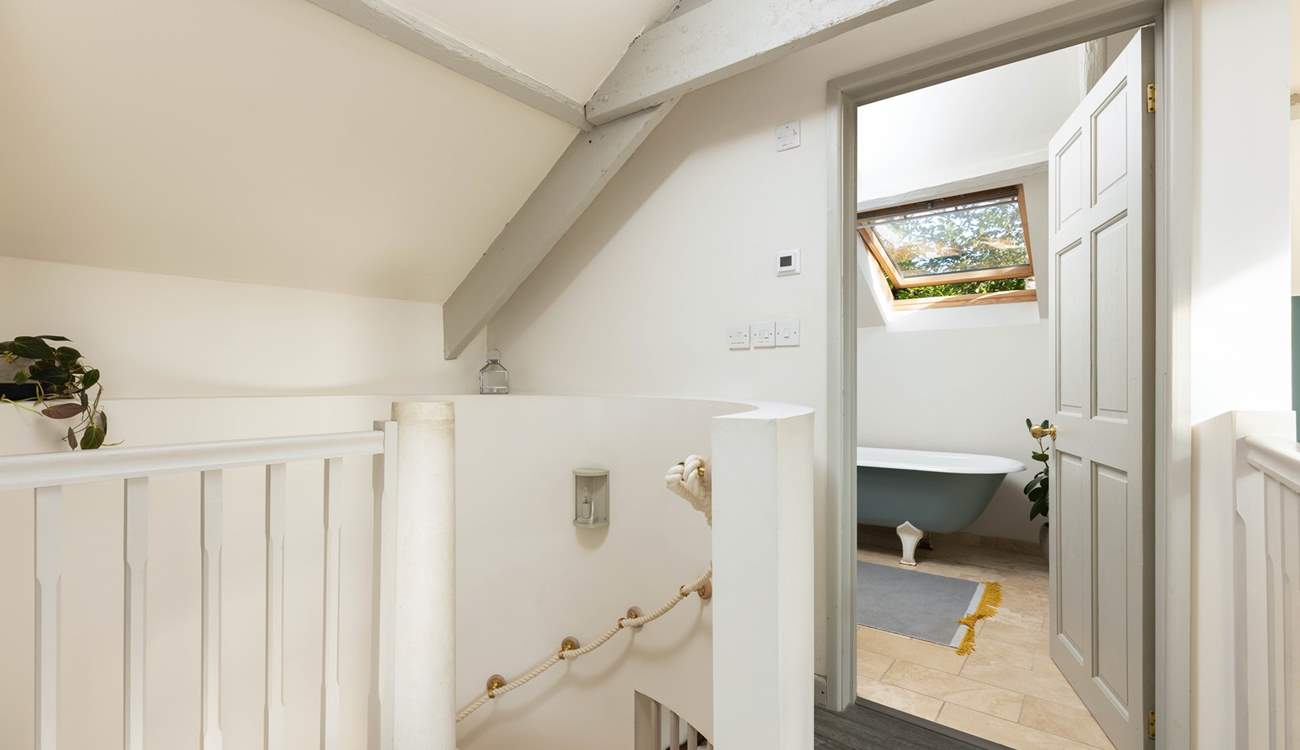 Peeking into the en suite and down the spiral staircase from bedroom two.