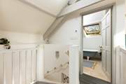 Peeking into the en suite and down the spiral staircase from bedroom two.