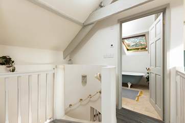 Peeking into the en-suite and down the spiral staircase from bedroom two.
