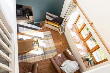 Looking down into the living room from bedroom two.
