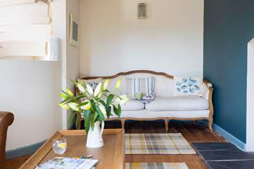 Snuggle up on the sofa or simply slip away into this private corner with a good book.