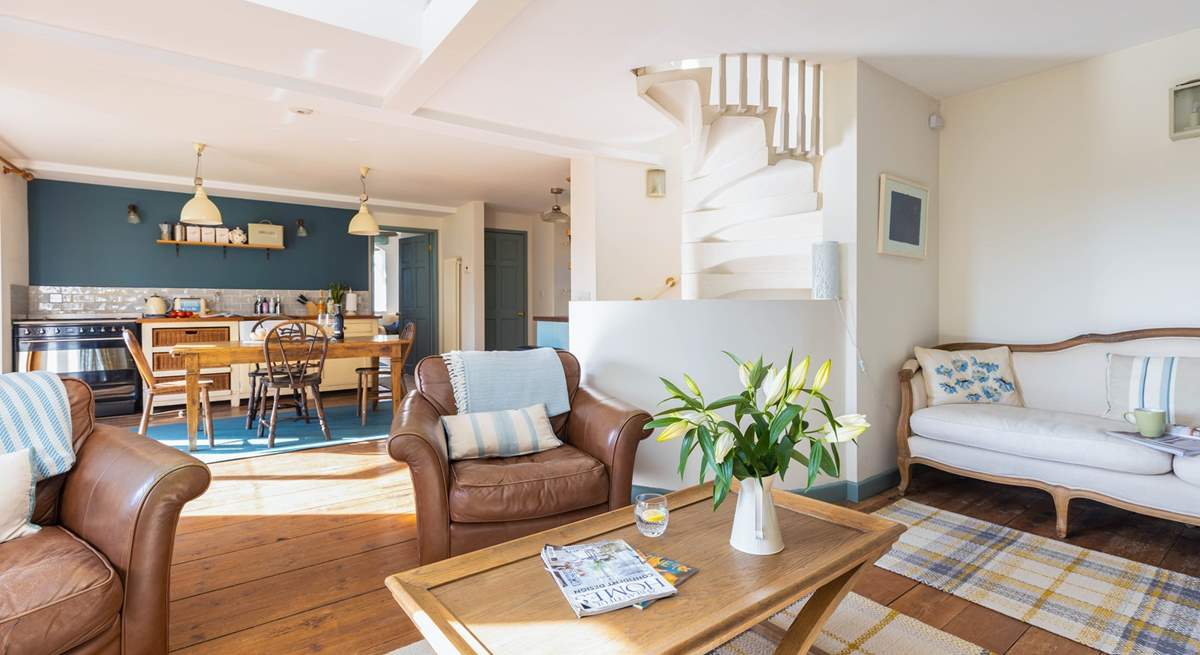 The stunning spiral staircase leads up from the living-room onto the first floor.