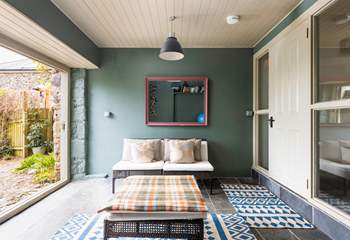 Step out of this beautiful garden room into your fully enclosed garden. Please mind the slight step.