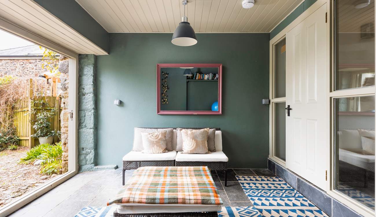 Step out of this beautiful garden room into your fully enclosed garden. Please mind the slight step.