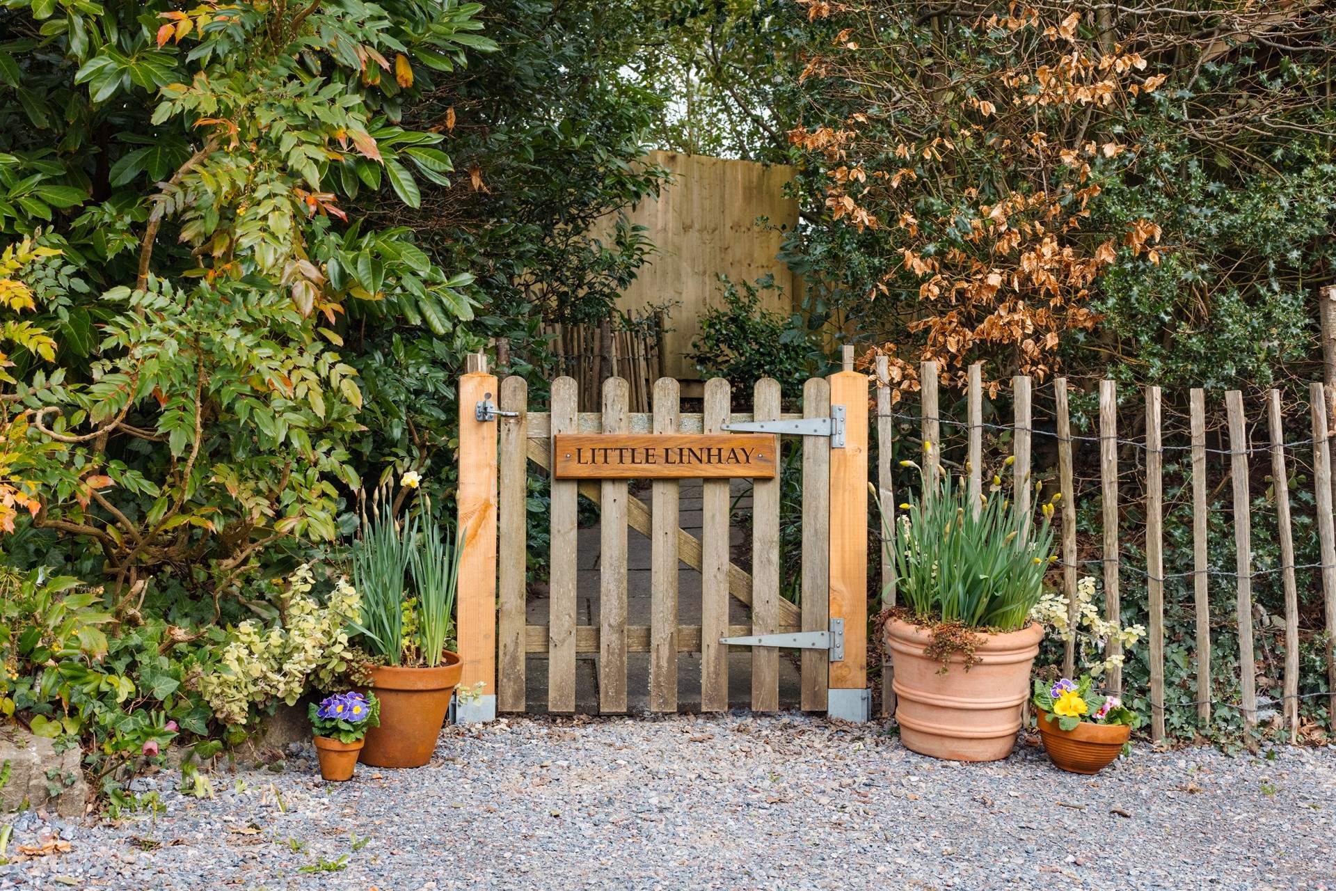 Once parked up, follow this pretty pathway to access your dream holiday cottage.