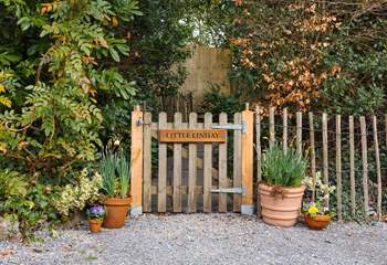 Once parked up, follow this pretty pathway to access your dream holiday cottage.