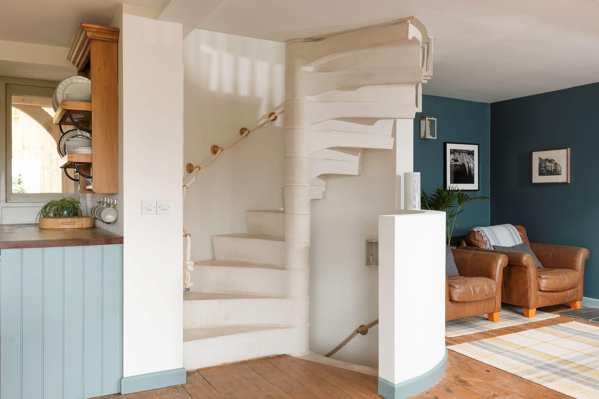 The stunning spiral staircase takes you up to the main bedroom, down to the garden-room and out to the stunning walled rose garden.