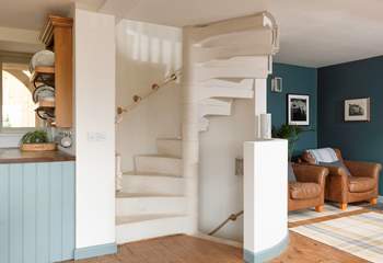 The stunning spiral staircase takes you up to the main bedroom, down to the garden-room and out to the stunning walled rose garden.