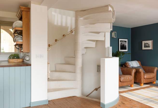 The stunning spiral staircase takes you up to the main bedroom, down to the garden-room and out to the stunning walled rose garden.