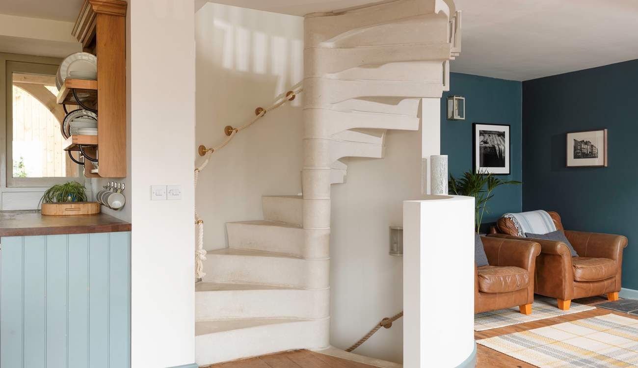 The stunning spiral staircase takes you up to the main bedroom, down to the garden-room and out to the stunning walled rose garden.