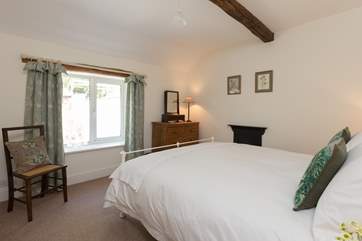 This is the second bedroom, looking out over the rear garden.