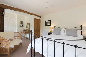 This is the main, front facing bedroom, with its lovely iron framed king-sized bed.