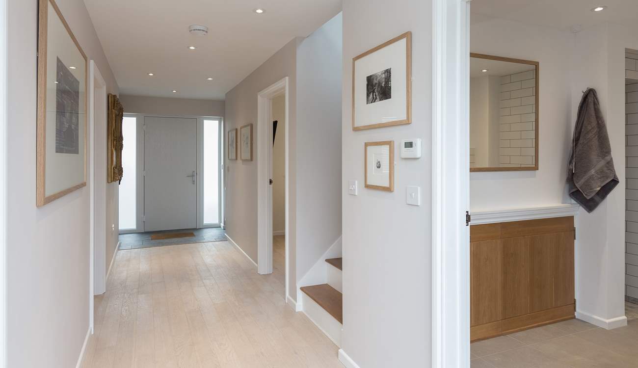 The Willows has a wide hall that links the front and back doors and gardens. With stunning original artwork by local artists on all the walls, this is a really special place to stay.