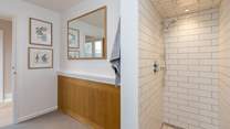 The walk-in shower is cleverly designed along the lines of a wet-room.