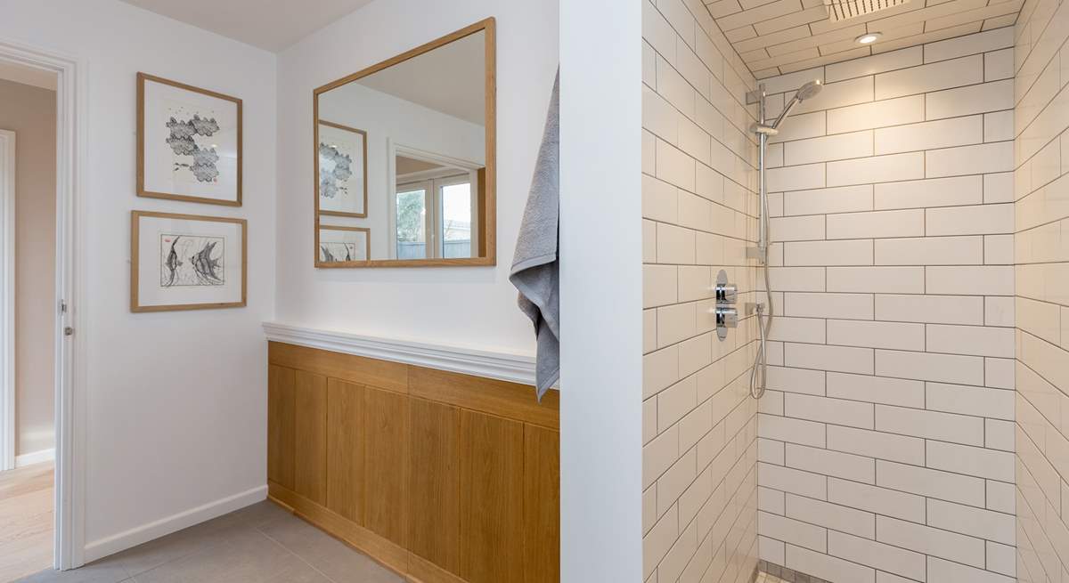 The walk-in shower is cleverly designed along the lines of a wet-room.