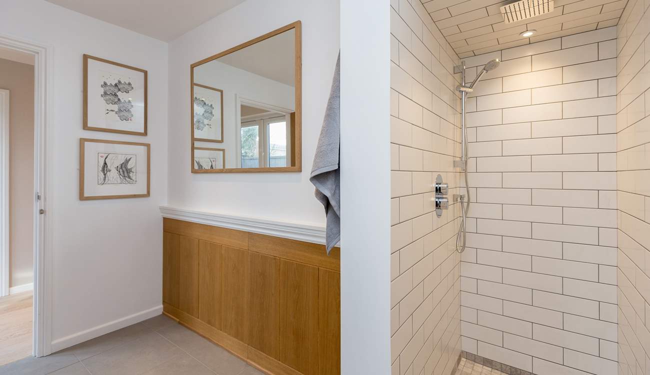 The walk-in shower is cleverly designed along the lines of a wet-room.