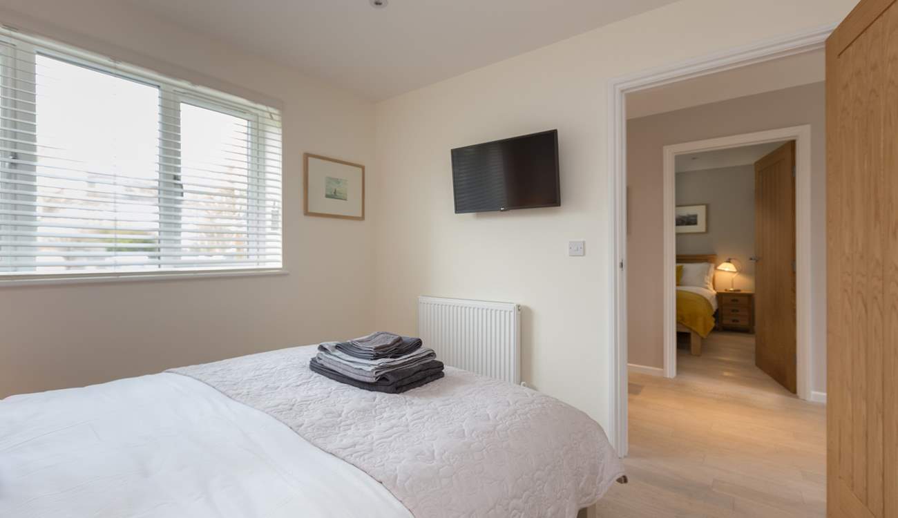 Both the double bedrooms have wall-mounted TVs.