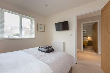 Both the double bedrooms have wall-mounted TVs.