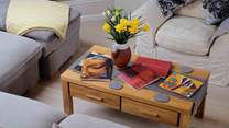 Upstairs offers a spacious, bright living space with plenty of room to relax and socialise.