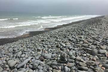The long pebble ridge along the top edge of the beach is a wonderful natural landmark.