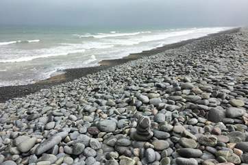 The long pebble ridge along the top edge of the beach is a wonderful natural landmark.