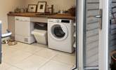 A well thought out utility space offering access to separate laundry facilities, 2nd fridge freezer, wet suits, towels and somewhere to tend to your dog.  - Thumbnail Image