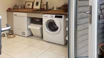 A well thought out utility space offering access to separate laundry facilities, 2nd fridge freezer, wet suits, towels and somewhere to tend to your dog. 