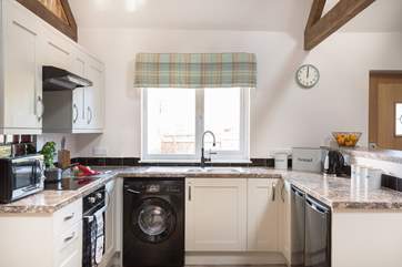 The kitchen is a social space where the cook can chat whilst preparing breakfast, lunch or dinner.