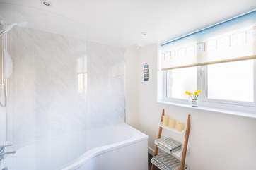 The family bathroom is between the kitchen and the twin bedroom.
